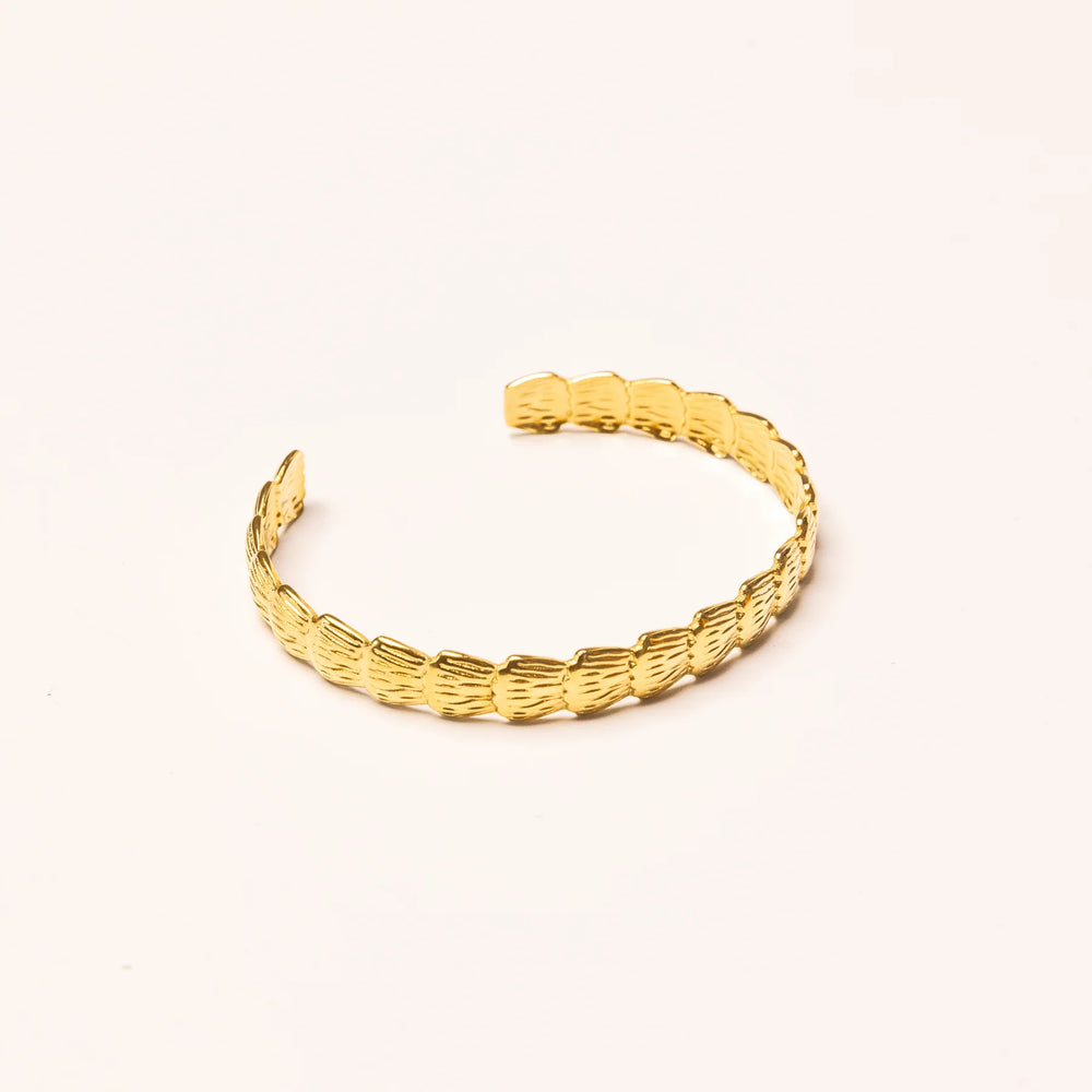 
                      
                        We Are Emte - Scallop Cuff in Gold
                      
                    