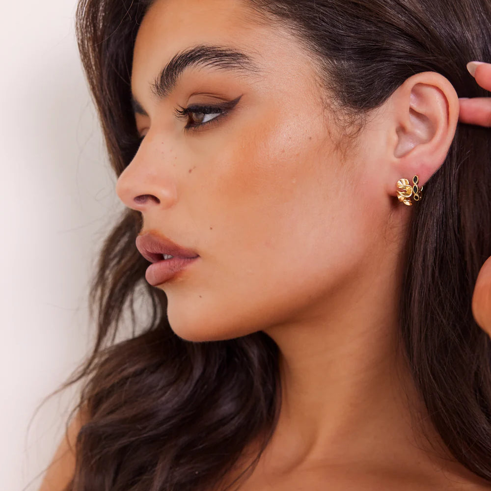 
                      
                        We Are Emte- Squiggle Studs in Gold
                      
                    