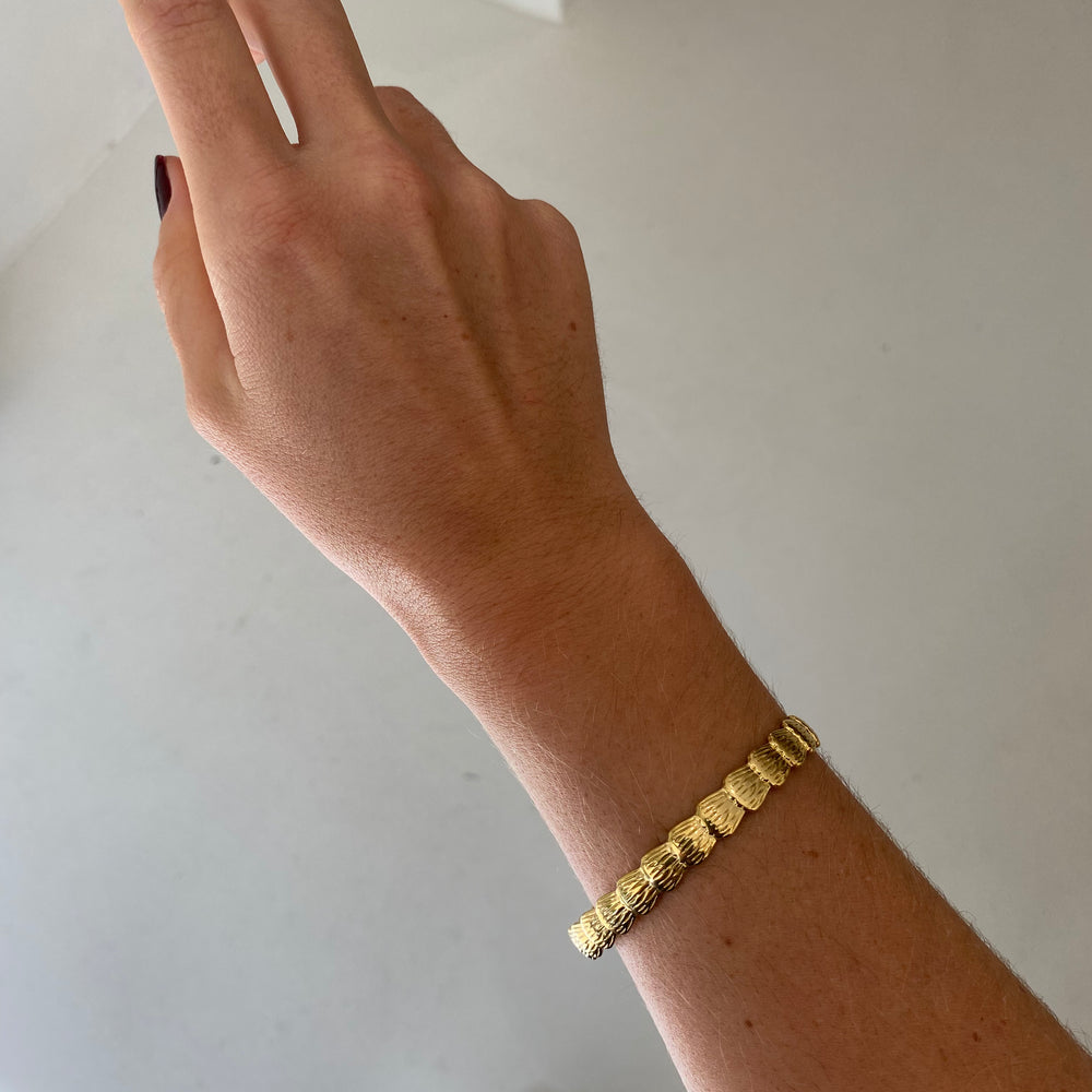 
                      
                        We Are Emte - Scallop Cuff in Gold
                      
                    